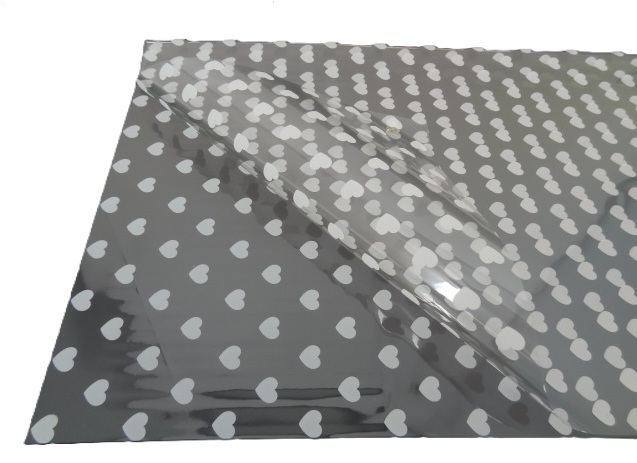 Folia florystyczna arkusz 58x58cm 20szt transparentna w białe serca SYX-1 